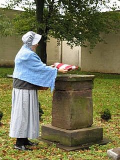 Placing the Flag on the Higgins Monument